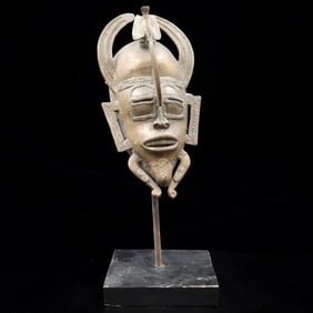 A Brass Senufo Kpeliye'e Mask, Ivory Coast