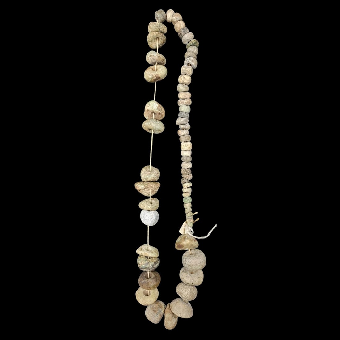An African Graduated Trade Beads Necklace: **DUE TO THIS LOT BEING JEWELRY IT MUST BE PAID VIA BANK WIRE TRANSFER OR CERTIFIED CHECK.** An African Graduated Trade Beads Necklace. Measures approximately 15-1/2" clasped. Please c
