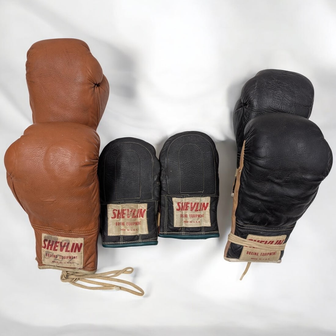 Three Pairs Of Vintage Shevlin Boxing Gloves: Three Pairs Of Vintage Shevlin Boxing Gloves. Measures approx. 9" X 6". Please copy and paste the URL link below to review our Terms and Conditions for bidding, payment, shipping and other sp
