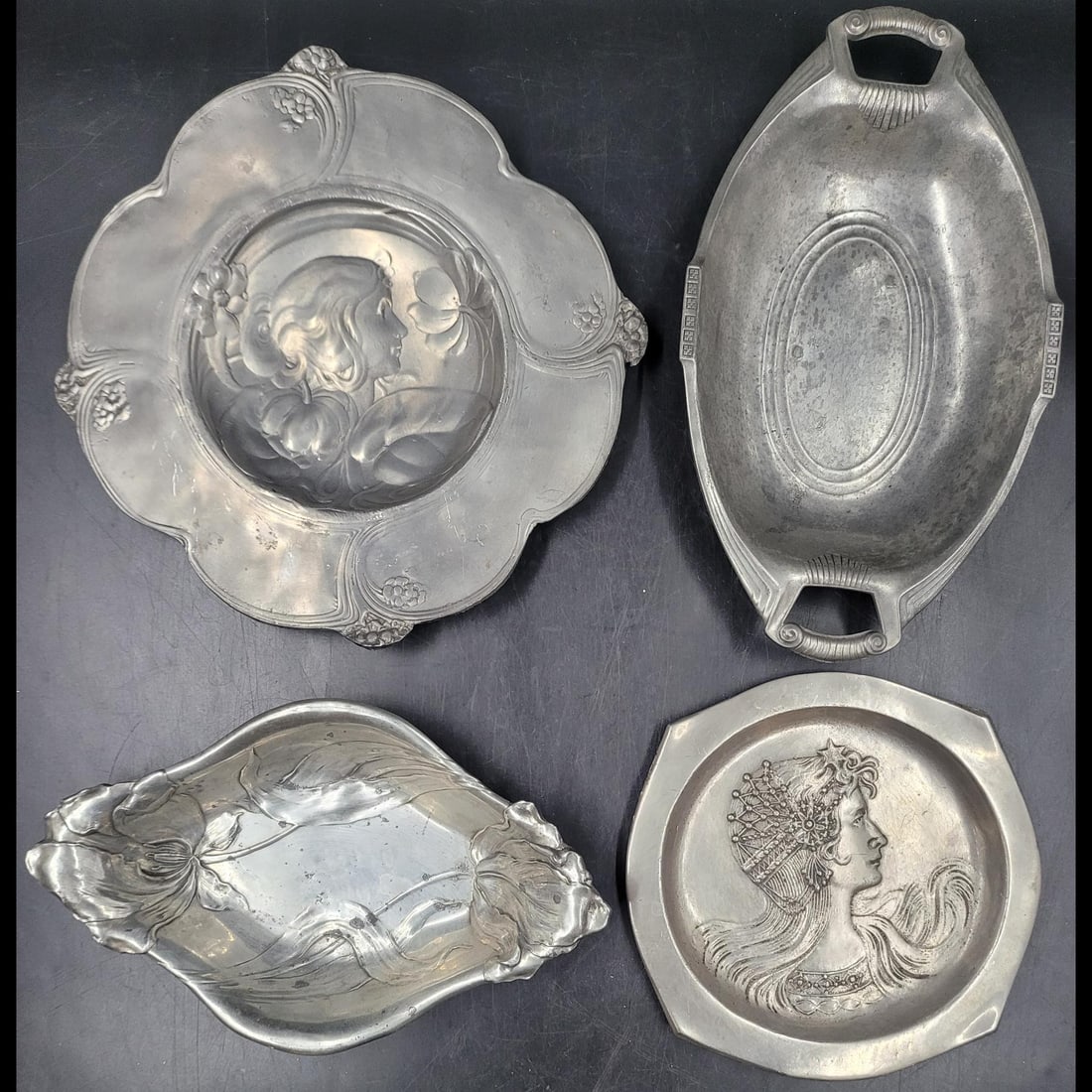 Lot Of 4 Art Nouveau Pewter Dinnerware: Lot Of 4 Art Nouveau Pewter Dinnerware. Measures from approx. 12.25" X 12.25" to 8.5" X 8.5" Please copy and paste the URL link below to review our Terms and Conditions for bidding, payment