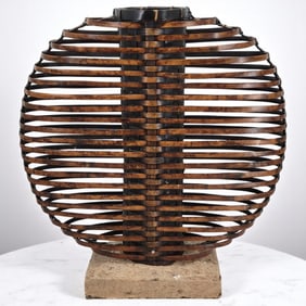 An Antique Japanese Bamboo Woven Planter Mounted On Stone