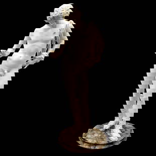 A White Narcissus Statue Mounted On Granite: A White Narcissus Statue Mounted On Granite. Measures approximately 25" tall x 9" diameter. The finger has been previously repaired. Please copy and paste the URL link below to review our Ter