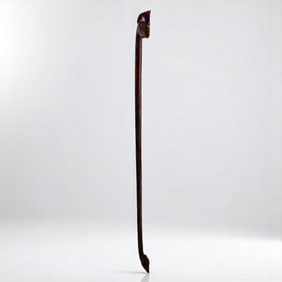 An Oceanic Carved Hardwood Carrying Rod Inlaid W/ Obsidian Eyes