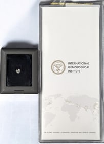 A Brilliant 1.01 CT Heart E VS1 Loose LAB GROWN Diamond In A Display Case With Diamond Report