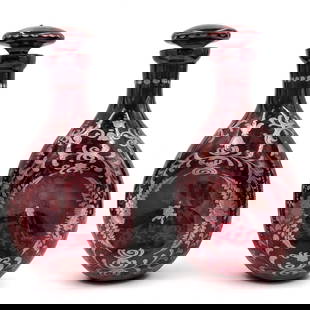Pair Of Beautiful Vintage Cranberry Pinched Glass Decanters With Toppers: Pair Of Beautiful Vintage Cranberry Pinched Glass Decanters With Toppers. Measures approx. 9 1/2" X 4 1/2" each. Please copy and paste the URL link below to review our Terms and Conditions