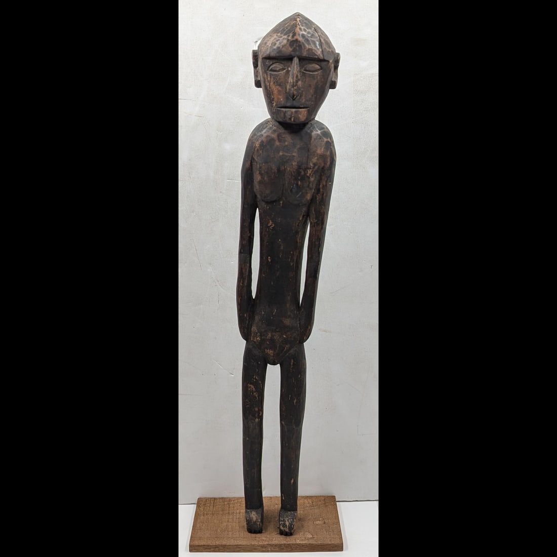 Tall African Tribal Carved Wood Female Standing Figure: Tall African Tribal Carved Wood Female Standing Figure. Measures approx. 23 1/2" tall. Please copy and paste the URL link below to review our Terms and Conditions for bidding, payment, ship