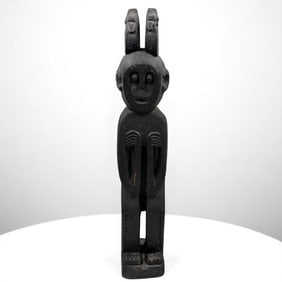 A Unique African Carved Wood Male Tribal Figure With Zoomorphic Creatures