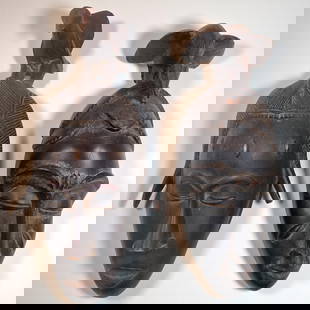 Pair Of Wood Carved African Baule Or Guro Masks With Bird: Pair Of Wood Carved African Baule Or Guro Masks With Bird. Measures approx. 16.5" X 7" X 5" and 14" X 5.5" X 4.5" Please copy and paste the URL link below to review our Terms and Conditions
