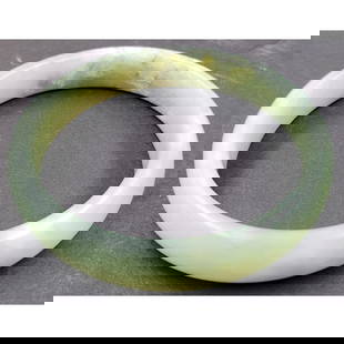 Chinese Jade Bangle: **DUE TO THIS LOT BEING JEWELRY IT MUST BE PAID VIA BANK WIRE TRANSFER OR CERTIFIED CHECK.** Chinese Jade Bangle. measures approx. 2.25" inner diameter, 2.75" outer diameter, 0.5" width.