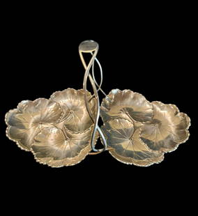 Reed and Barton signed sterling silver serving handled dish with lotus leaf pattern: Reed and Barton signed sterling silver serving handled dish with lotus leaf pattern. Signed on underside. Rare form and weighing 460 grams. Measure 14" wide and 7" tall. Please READ & REVIEW our Terms