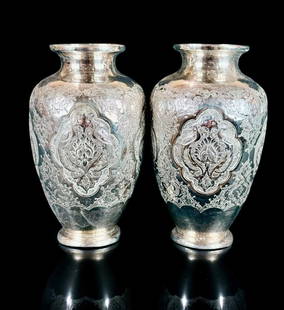 Pair of Persian Sterling Silver Vases, 292 Grams: ***DUE TO THIS LOT BEING SILVER IT MUST BE PAID VIA BANK WIRE TRANSFER OR CERTIFIED CHECK.*** Pair of Persian Sterling Silver Vases. Measures 4.5" tall and weight 292 grams. Excellent condition. Pleas
