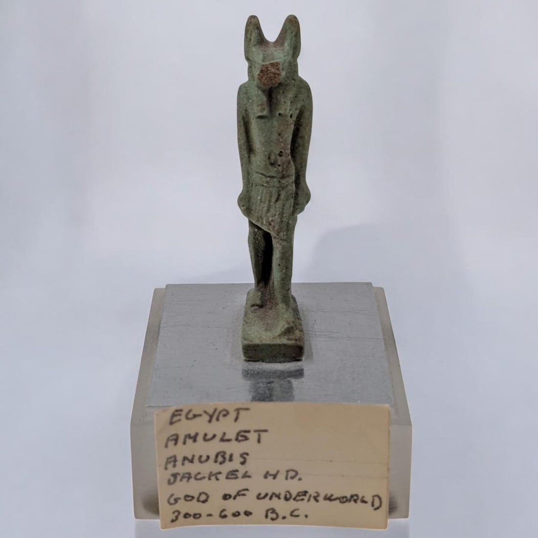 An Old Egyptian Anubis Amulet Mounted On Stand: An Old Egyptian Anubis Amulet Mounted On Stand. This item was obtained in the 80’s from the Doris Weinee and Kapoor Galeries in New York. The item did come from a private estate in Bakersfield, Cali