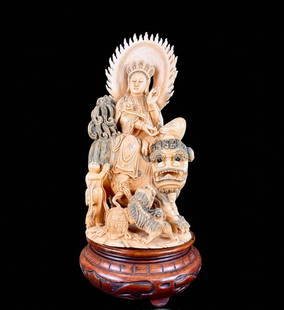 Antique Carved Chinese Seated Figure Of Kwan Yin, Museum Quality: Spectacular antique carved figure of a seated Kwanyin with crown, acolyte servant and seated atop a biche’ dragon. All carved from a single bone piece. Marked to base. Overall 14" tall. Excellent