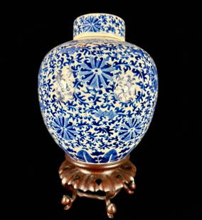 A Chinese Blue And White Lidded Jar: Antique Chinese blue and white lidded jar with original stand and lid. Stands overall 14" tall, jar alone is 11&rdquo; tall. Excellent condition. Please READ & REVIEW our Terms and Conditions before b