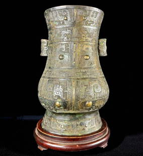 A Chinese Antique Bronze Arrow Vase: Chinese antique ancient form bronze arrow form vase on custom stand. At some point made into a lamp. Stands 14" tall and 9" wide. Please READ & REVIEW our Terms and Conditions before bidding, payment,