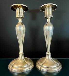 Pair Of Sterling Silver Candlesticks, 606 Grams: ***DUE TO THIS LOT BEING SILVER IT MUST BE PAID VIA BANK WIRE TRANSFER OR CERTIFIED CHECK.*** Pair of sterling candlesticks. Marked. Measures 9" tall and 606 grams weight. Please READ & REVIEW our Ter