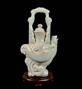 Early Chinese Qingbai Sky Blue Glazed Pottery Ewer, Phoenix Form: Antique Chinese qingbai sky blue glaze and incised pottery wine ewer in the form of a phoenix. Dates 18th century or older. Clearly in the glaze and pottery style of song dynasty wares. Measures 10"