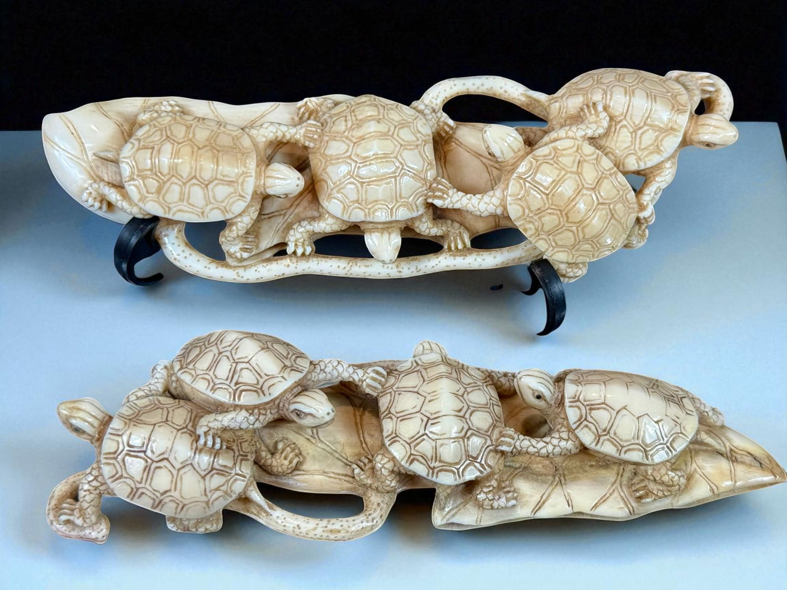 A Pair Of Artist Signed Antique Japanese Figure Turtles On A Lotus: Pair antique Japanese bone carvings depicting turtles on a lotus leaf. Signed by artist and in excellent condition. Measures 5.5" X 3.5" X 2" each. Please READ & REVIEW our Terms and Conditions before