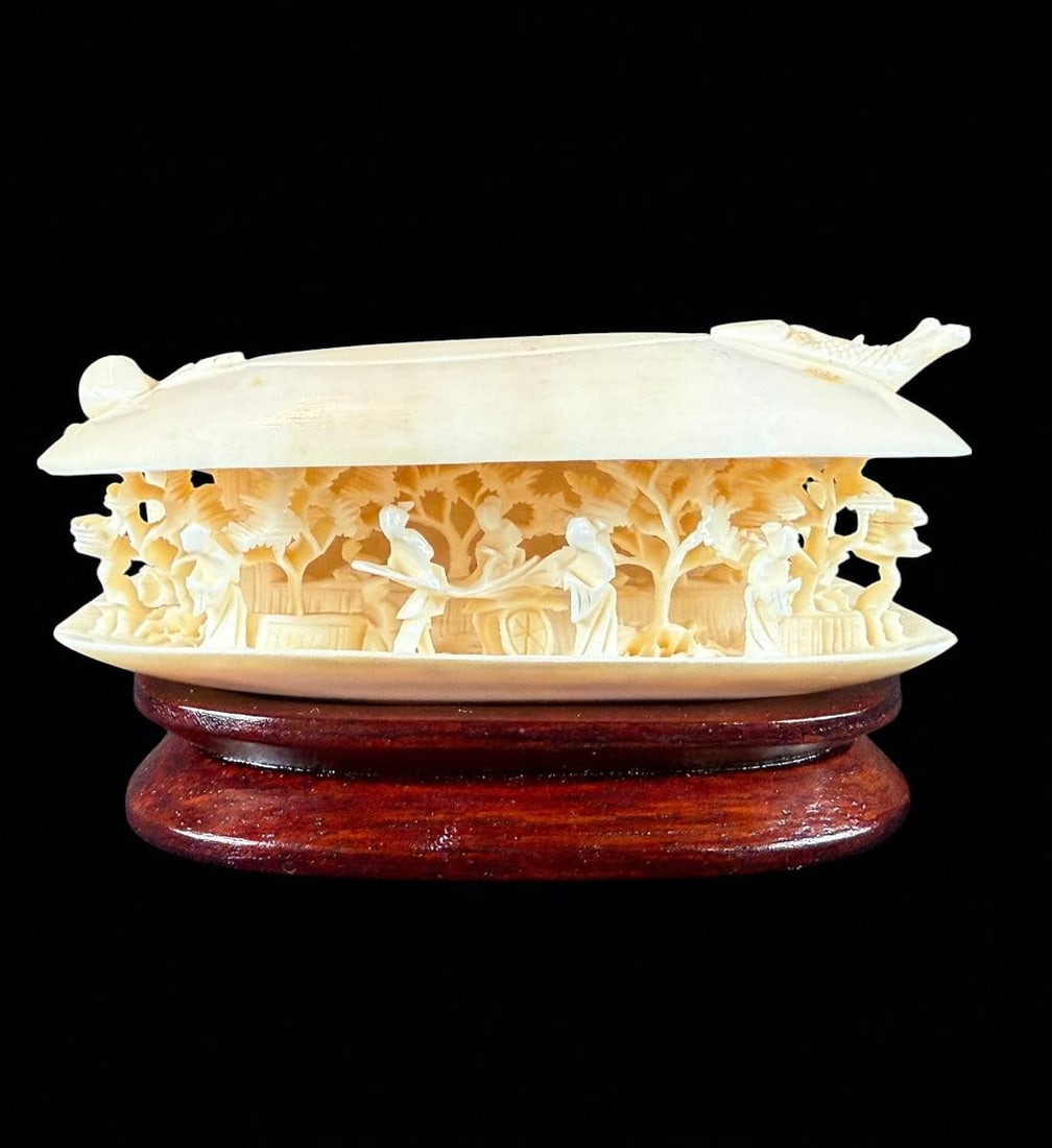 A Very Fine Diminutive Chinese Carved Figure Of A Village Ca. 1900: Amazingly details diminutive Chinese antique bone carving depicting an entire genre village scene inside a clam shell. Perfect condition. Circa 1900. Measures 4.25" wide 2" deep 2.5" tall overall. Ple
