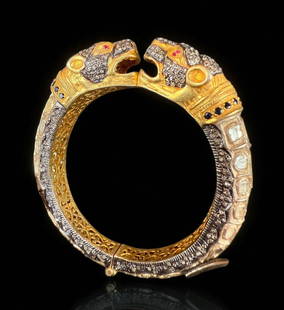Extraordinary And Rare Antique Jaguar Head Cartier Style Mughal Or Indian Kada Bracelet: **DUE TO THIS LOT BEING JEWELRY IT MUST BE PAID VIA BANK WIRE TRANSFER OR CERTIFIED CHECK.** Extraordinary And Rare Antique Jaguar Head Cartier Style Mughal Or Indian Kada Bracelet. Gold over silver a