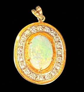 Large Vibrant Fire Opal Pendant Mounted In 18k Gold With Very High Quality Diamonds: **DUE TO THIS LOT BEING JEWELRY IT MUST BE PAID VIA BANK WIRE TRANSFER OR CERTIFIED CHECK.** Large vibrant fire opal pendant mounted in 18k gold surrounded by full cut high quality diamonds. Total wei