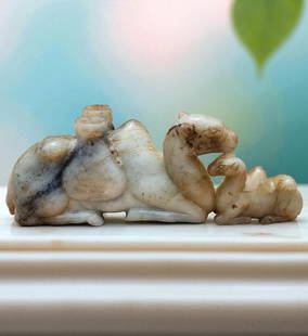 A Finely Carved Chinese Jade Camel Mother & Baby Qing Dynasty: A Finely Carved Chinese White Jade Camel Mother & Baby Qing Dynasty. Measures 10.5" X 4". Provenance: Private Estate. Please READ & REVIEW our Terms and Conditions before bidding, payment, shipping an