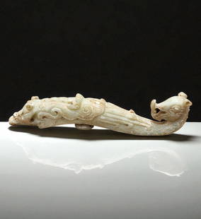 A Large Chinese Carved Jade Belt Hook Qing Dynasty: A Large Chinese Carved Jade Belt Hook Very Early Qing Dynasty. Measures 10.5" X 4". Provenance: Private Estate. Please READ & REVIEW our Terms and Conditions before bidding, payment, shipping and othe