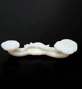 A Large Chinese Carved White Jade Ruyi Scepter Decorated With Peach & 2 Chilongs: A Large Chinese Carved White Jade Ruyi Scepter Decorated With Peach & 2 Chilongs. Measure Approx 10" Long X 1 3/4" X 2.5". Provenance: Private Estate. Please READ & REVIEW our Terms and Conditions bef