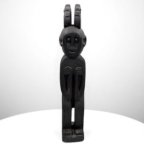 A Unique African Carved Wood Male Tribal Figure With Zoomorphic Creatures
