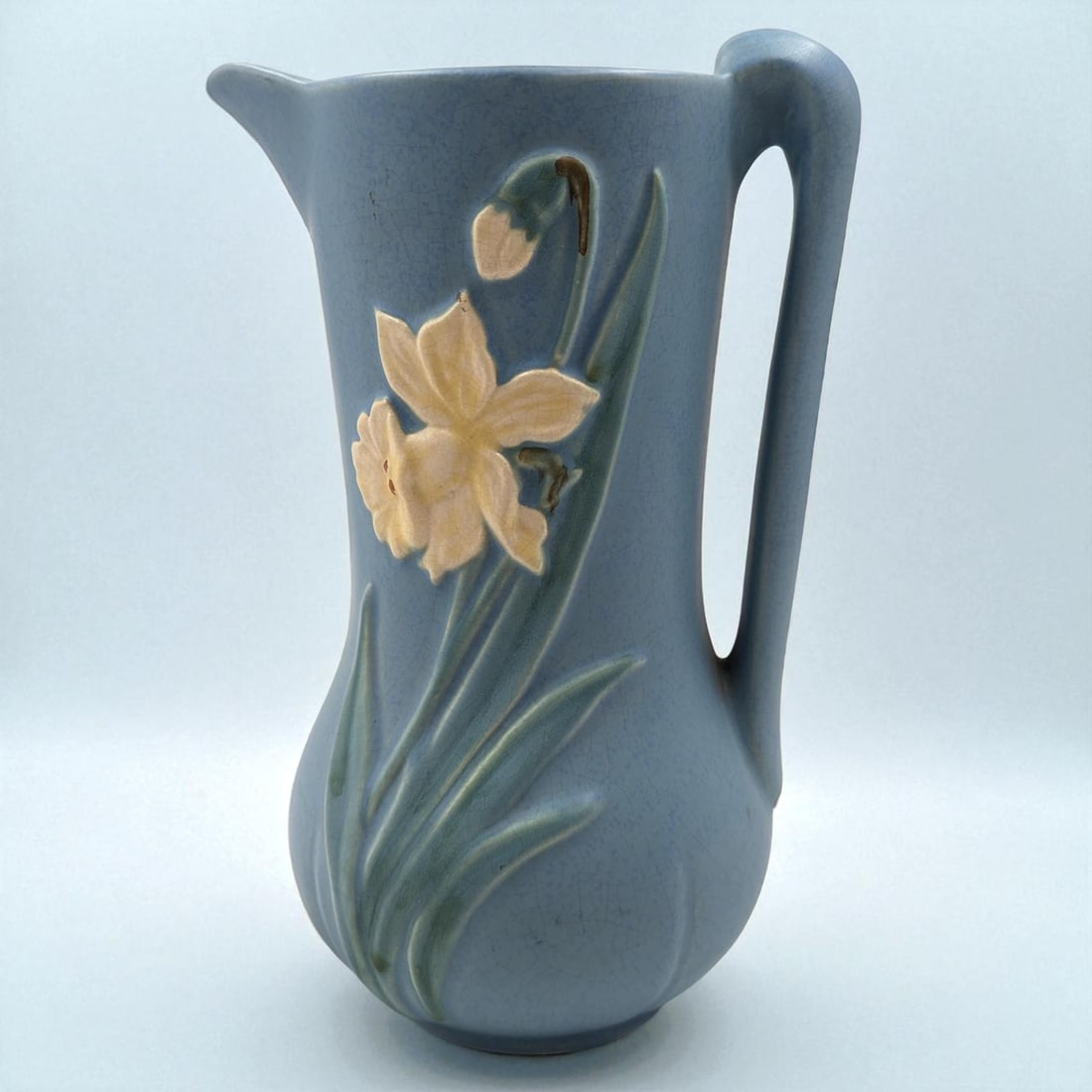 Vintage Weller Pottery Blue Bouquet Pattern 10" Pitcher: Vintage Weller Pottery Blue Bouquet Pattern Pitcher. Measures approx. 10" tall. Please copy and paste the URL link below to review our Terms and Conditions for bidding, payment, shipping