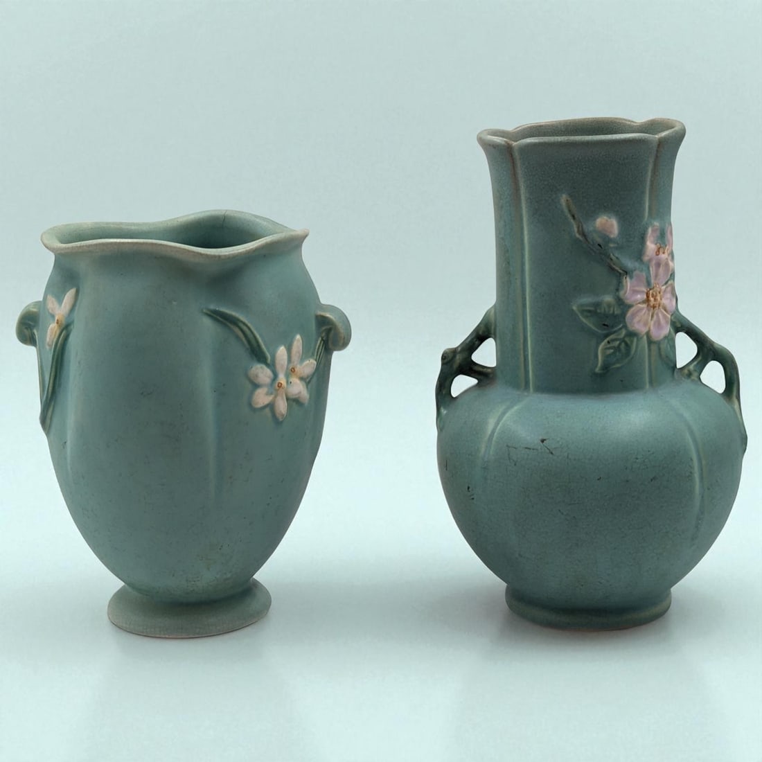 Pair Of Vintage Weller Turquoise Pottery Vases, Wild Rose Double Handled And Floral Vase: Pair Of Vintage Weller Turquoise Pottery Vases, Wild Rose Double Handled And Floral Vase. Measures approx. 7 3/4" X 6 1/2" and 9 1/2" X 6". Please copy and paste the URL link below to rev