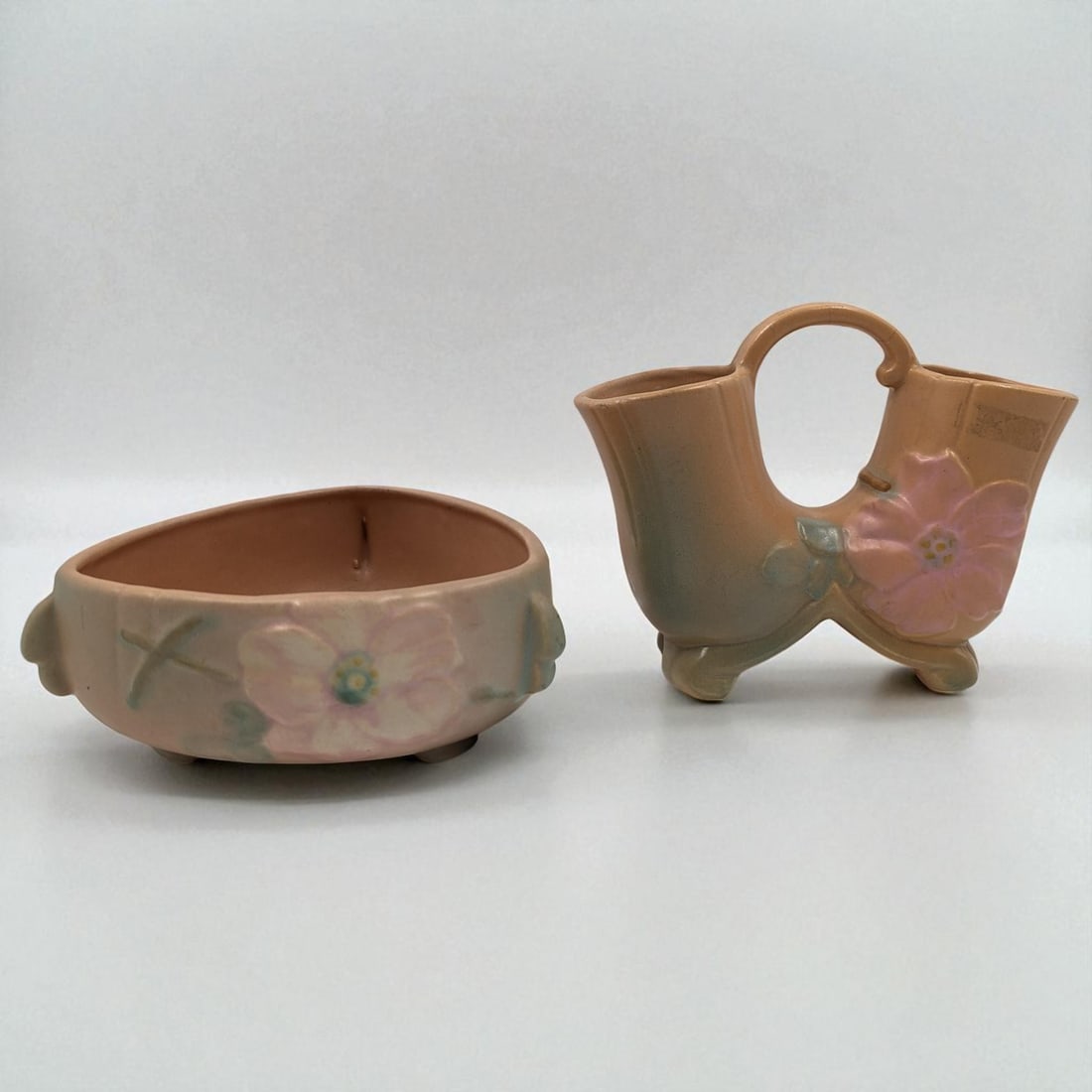Pair Of Vintage Weller Pottery Pieces, Peach Wild Rose Double Vase And Triangular Bowl: Pair Of Vintage Weller Pottery Pieces, Peach Wild Rose Double Vase And Triangular Bowl. Measures approx. 3" X 6 1/2" and 6 1/2" X 8". Please copy and paste the URL link below to review ou
