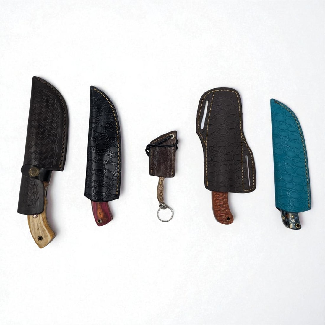 5Pc Hand Made Damascus Steel Knives And Sheathes: **DUE TO THIS LOT BEING CLASSED AS A WEAPON IT MUST BE PAID VIA BANK WIRE TRANSFER OR CERTIFIED CHECK.** 5Pc Hand Made Damascus Steel Knives And Sheathes. Knives measure 4 1/2", 8 1/4", 8 3/4", 9", an