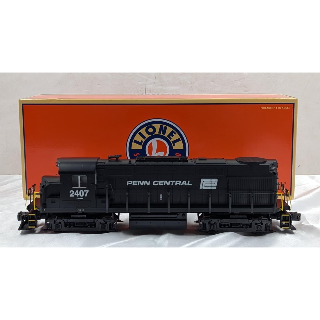 Lionel Penn Central Legacy RS-27 O-Gauge Diesel Locomotive Engine #2407: Lionel Penn Central Legacy RS-27 O-Gauge Diesel Locomotive Engine #2407. Box measures approx. 6 1/2" X 17 1/2" X 5". Please copy and paste the URL link below to review our Terms and Cond