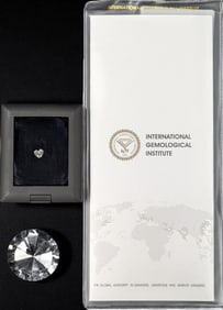 A Brilliant 1.01 CT Heart E VS1 Loose LAB GROWN Diamond In A Display Case With Diamond Report