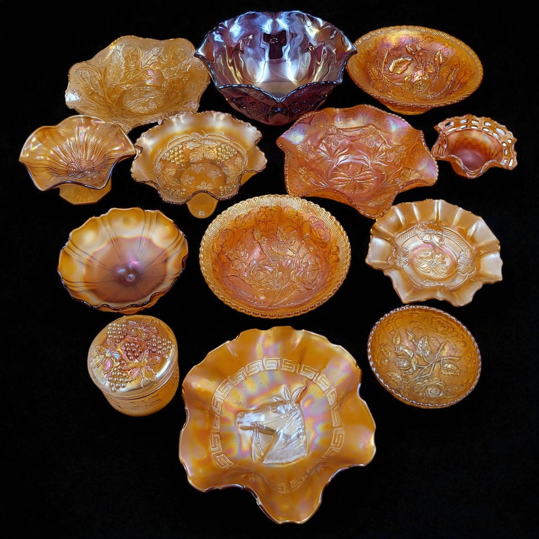 Lot Of 13 Carnival Glass Bowls: Lot Of 13 Carnival Glass Bowls. Measures approx. 5" X 10.5" X 10.5" to 3" X 4" X 4". Please copy and paste the URL link below to review our Terms and Conditions for bidding, payment, shippi