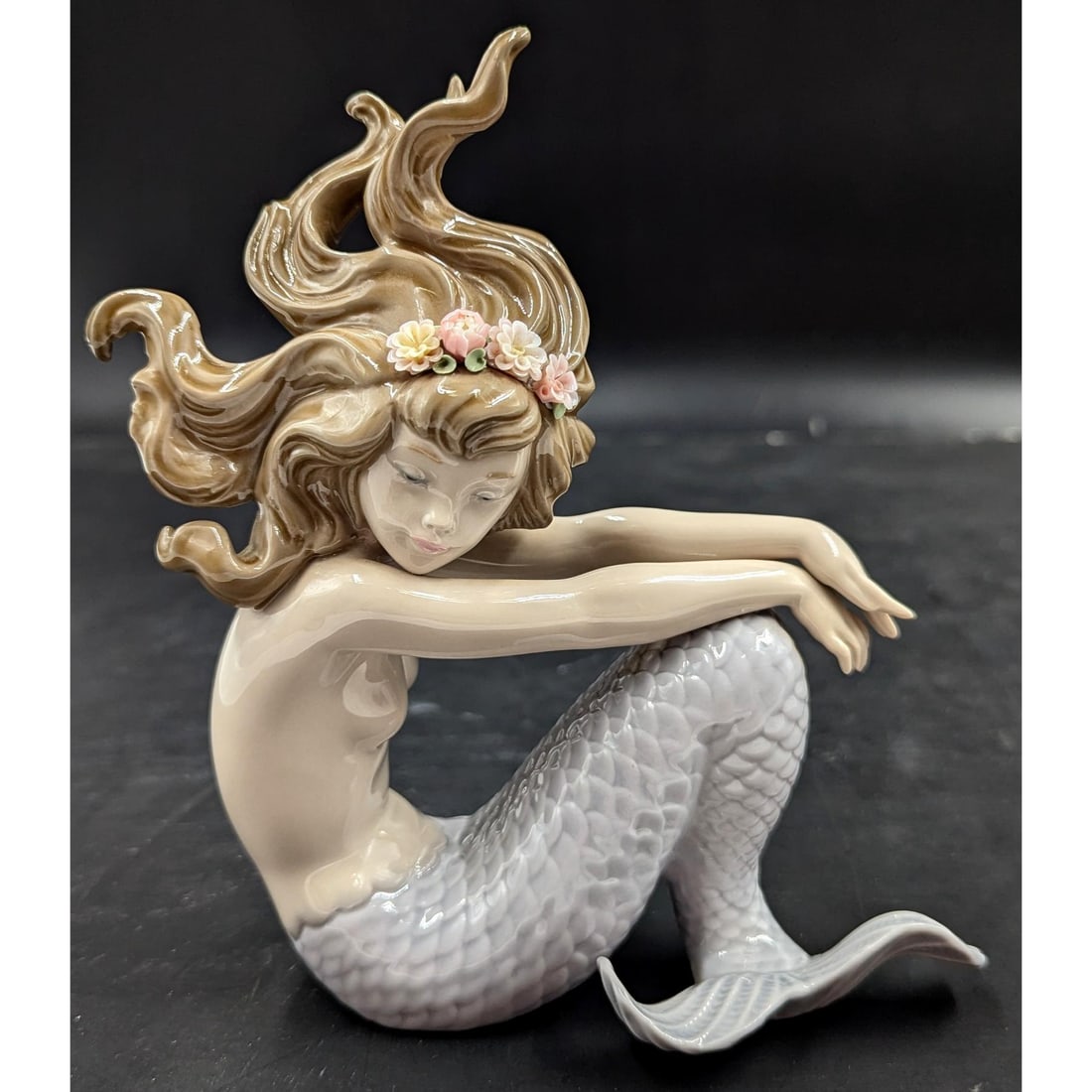 Lladro Figurine: "Illusion" #1413 Mermaid Figurine: Lladro Figurine: "Illusion" #1413 Mermaid Figurine. Measures approx. 6" X 1 3/4" X 7". Please copy and paste the URL link below to review our Terms and Conditions for bidding, payment, sh