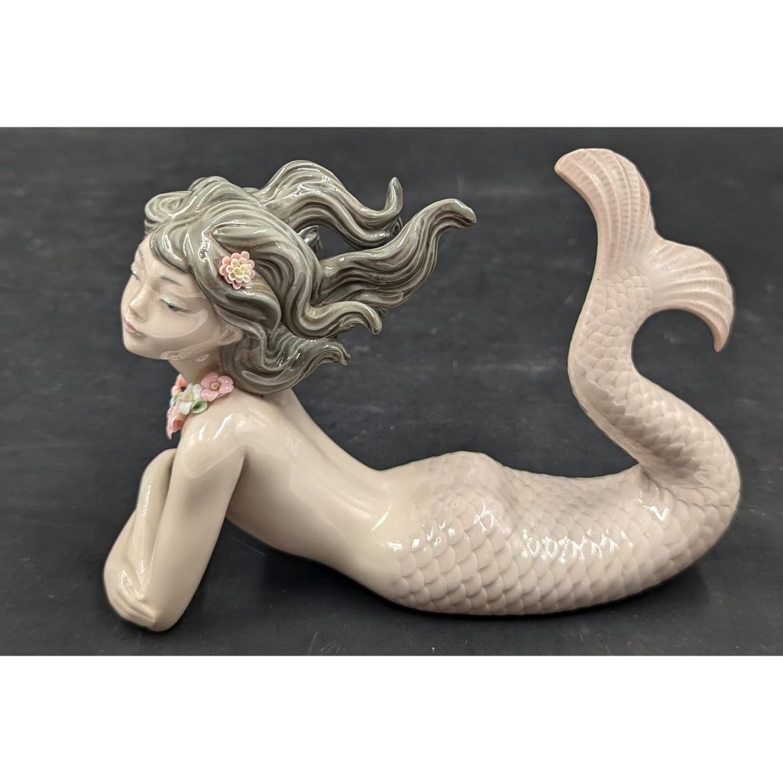 Lladro Figurine: "Fantasy" #1414 Mermaid Figurine: Lladro Figurine: "Fantasy" #1414 Mermaid Figurine. Measures approx. 6" X 2" X 4 1/4". Please copy and paste the URL link below to review our Terms and Conditions for bidding, payment, shi
