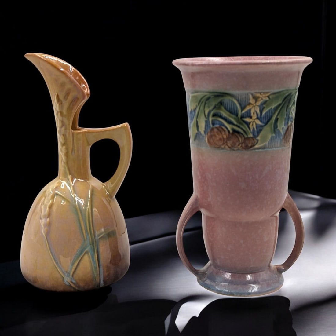 Pair Of Vintage Roseville Pottery Pieces, An Orange Wincraft Ewer And A Pink Baneda Art Deco Vase: Pair Of Vintage Roseville Pottery Pieces, An Orange Wincraft Ewer And A Pink Baneda Art Deco Vase. Measures approx. 8 1/2" X 4" and 8 1/4" X 4 1/2". Please copy and paste the URL link belo