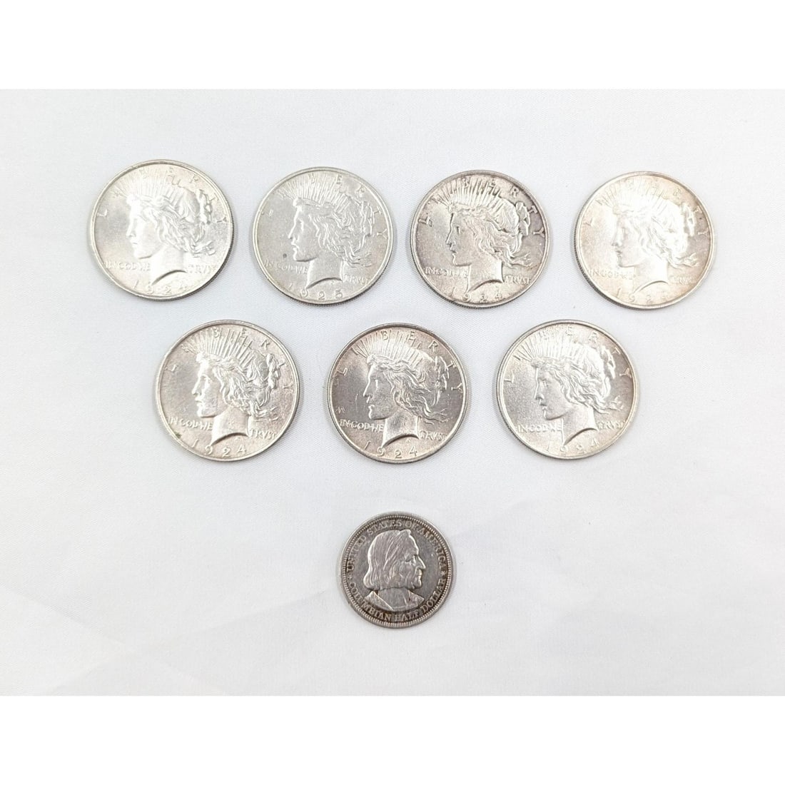Lot Of 7 1924/1925 Silver Dollars And An 1893 Uncirculated US Columbian Half Dollar, 200g Total (1 of 17)