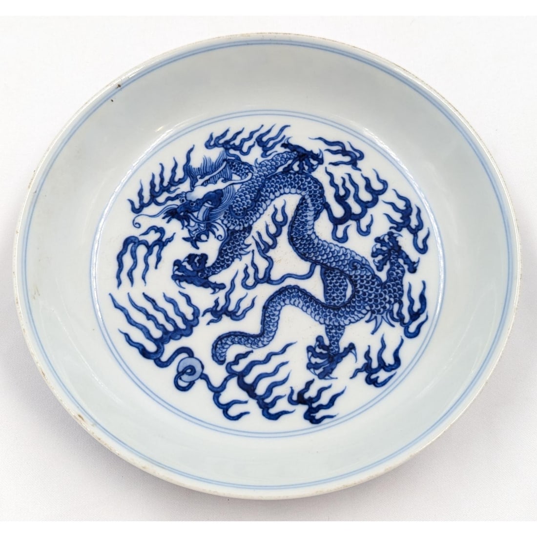 A Pair Of Chinese Blue And White Five-Clawed Dragon Bowls With Six Character Mark: A Pair Of Chinese Blue And White Five-Clawed Dragon Bowls With Six Character Mark. Measures approx. 1 1/4" X 6 3/4" each. Please copy and paste the URL link below to review our Terms and