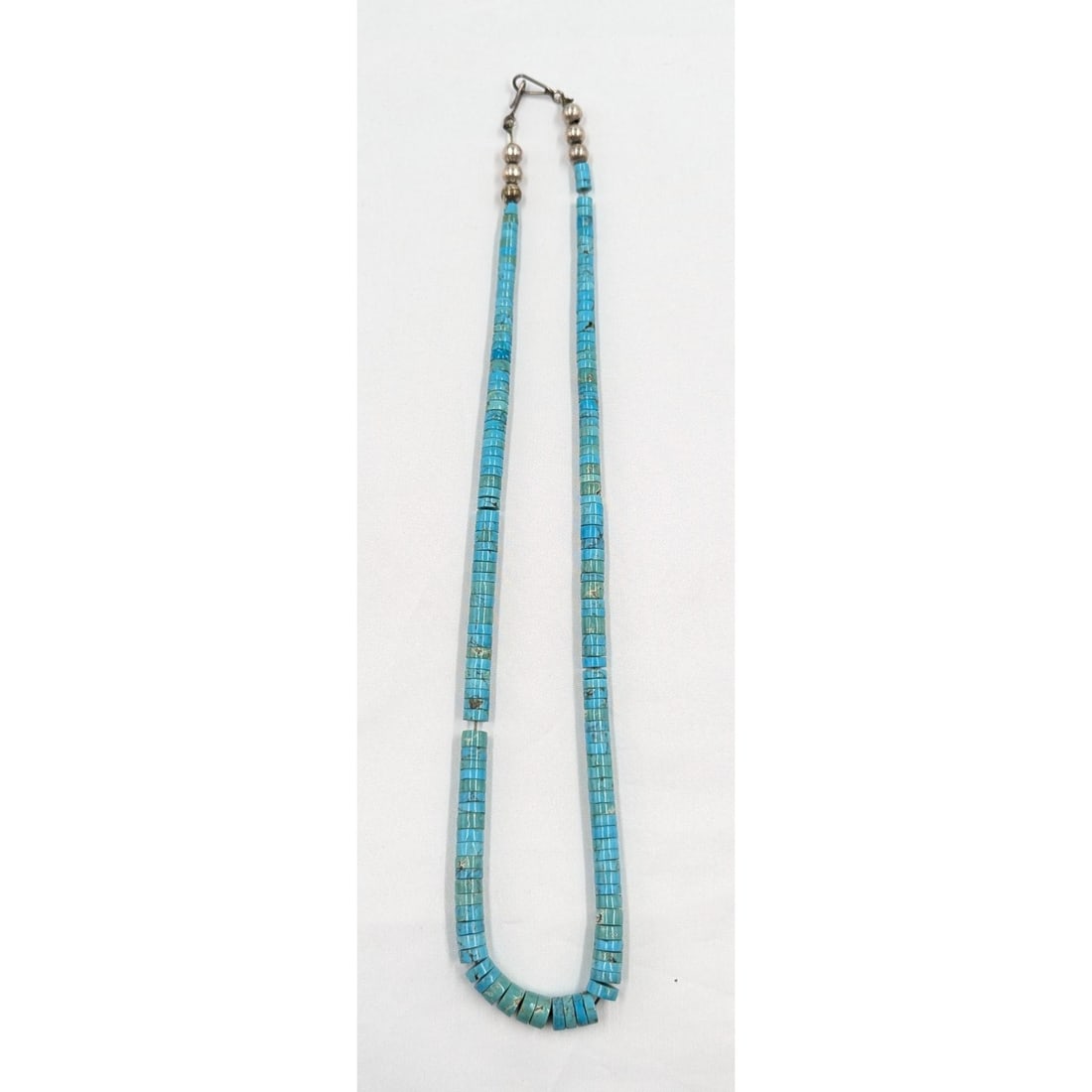 Vintage Santo Domingo Turquoise Necklace by "Paulito": ***DUE TO THIS LOT BEING JEWELRY IT MUST BE PAID VIA BANK WIRE TRANSFER OR CERTIFIED CHECK.*** Vintage Santo Domingo Turquoise Necklace by "Paulito". Measures approx. 22" long unclasped. Provenance: A