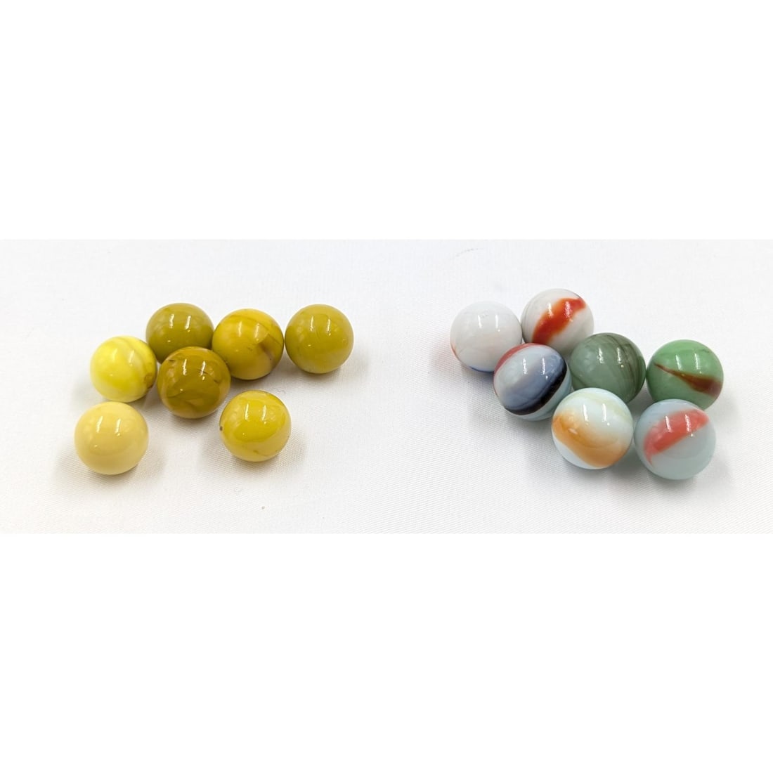 Marbles: Lot Of 14 Marbles In Two Groups, 7 Small Lemon Game Marbles And 7 Miscellaneous: Marbles: Lot Of 14 Marbles In Two Groups, 7 Small Lemon Game Marbles And 7 Miscellaneous. Bags measure approx. 3 1/2" X 2" each. Please copy and paste the URL link below to review our