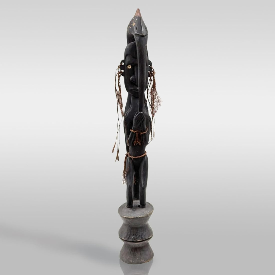 A Finely Carved Wooden Papua New Guinean Tribal Standing Figure: A Finely Carved Wooden Papua New Guinean Tribal Standing Figure. Please note that one of the arms are broken but is still attached. Measures approx. 22 1/2" tall. Provenance: Artifacts were acquired f