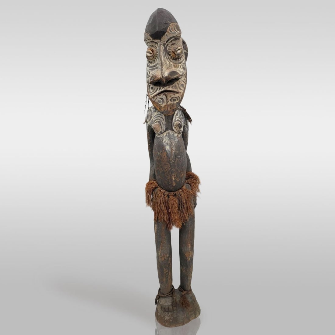 Large Antique Papua New Guinean Carved Wood Female Figure, Likely Sepik River: Large Antique Papua New Guinean Carved Wood Female Figure, Likely Sepik River. Measures approximately 39-1/2" tall X 6-1/2". Provenance: Artifacts were acquired from a private estate in South Florida.