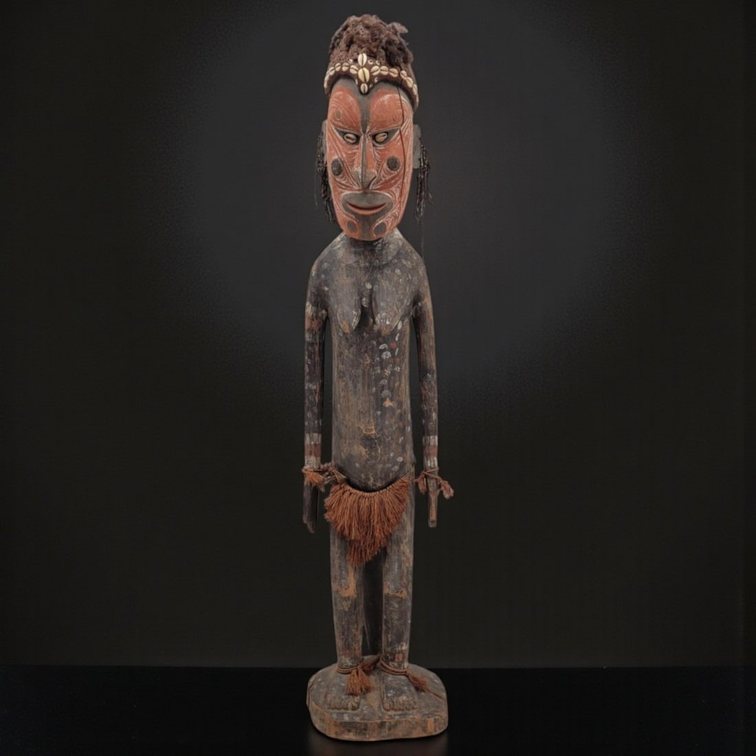 Large Antique Papua New Guinean Carved Wood Painted Sitting Female Figure: Large Antique Papua New Guinean Carved Wood Painted Sitting Female Figure. Measures approximately 43" tall x 9" wide. Provenance: Artifacts were acquired from a private estate in South Florida. The es