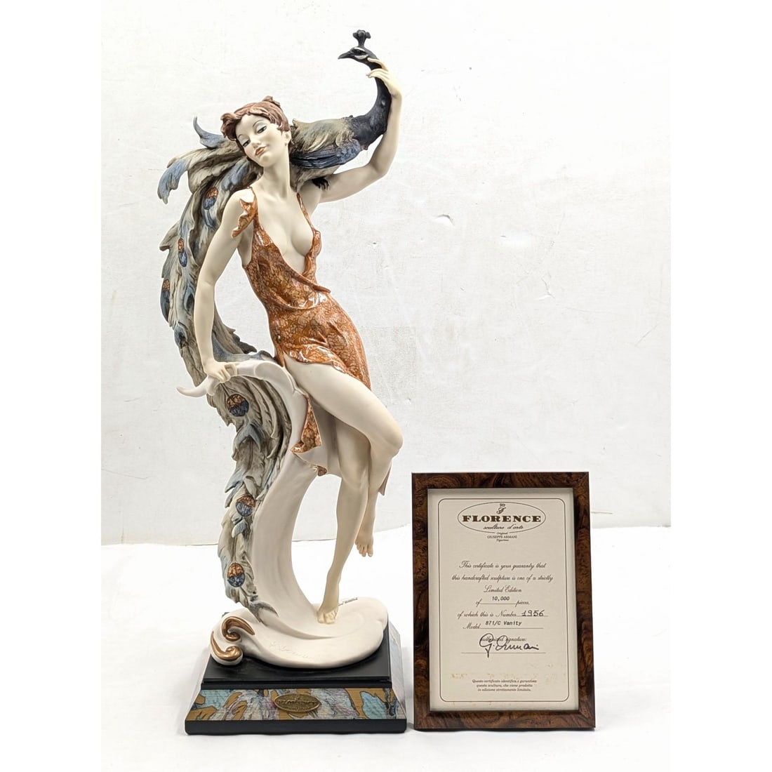 Giuseppe Armani Figurine: Limited Ed. 1956/10000 "Lady With Peacock" 871C With COA And Box: Giuseppe Armani Figurine: Limited Ed. 1956/10000 "Lady With Peacock" 871C With COA And Box. Box measures approx. 11 1/2" X 24" X 10 1/4" and 4" X 9 1/4" X 4". Please copy and paste the URL