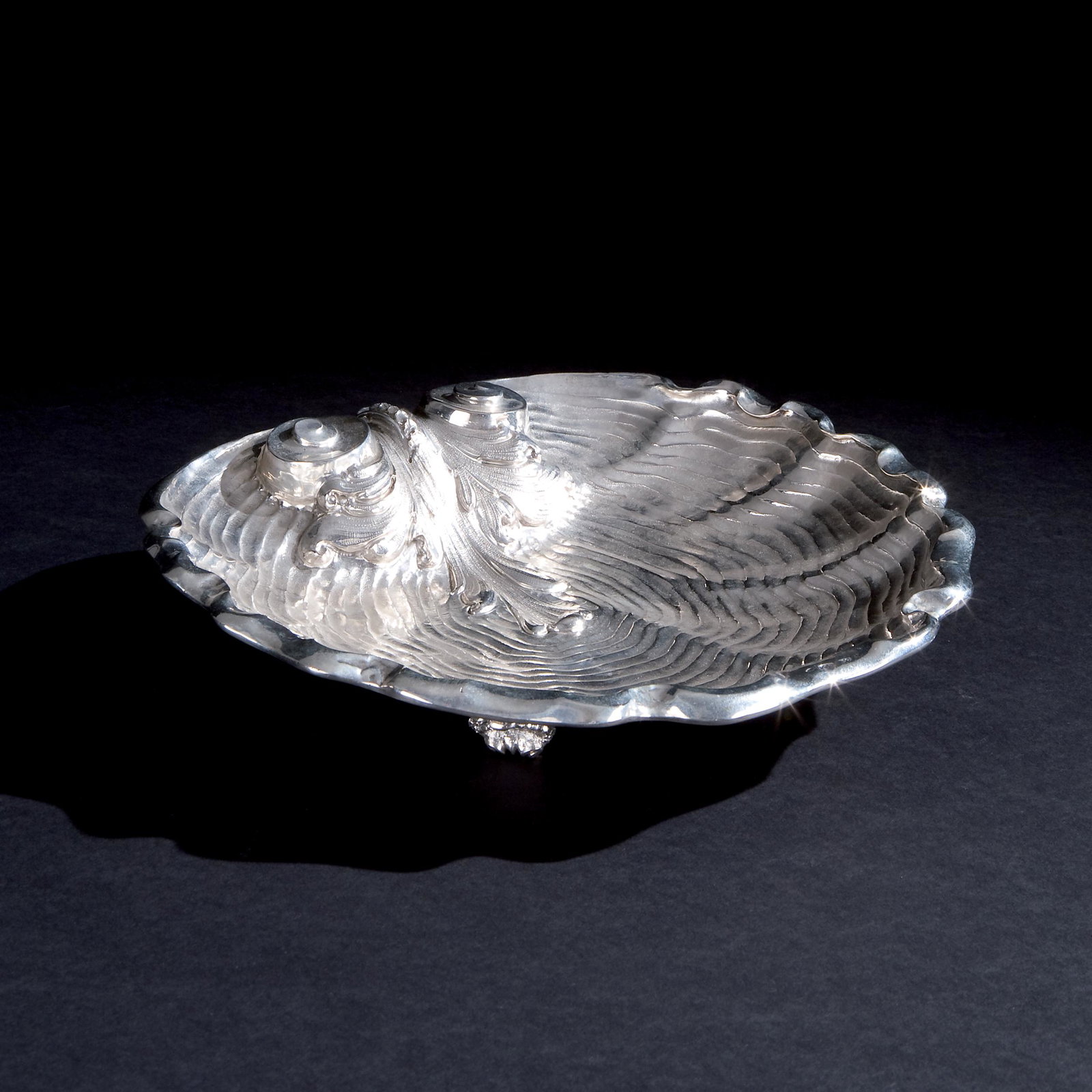 A silver seashell shaped bowl, Milan: Cacchione, 26by28cm., 596gr. weight