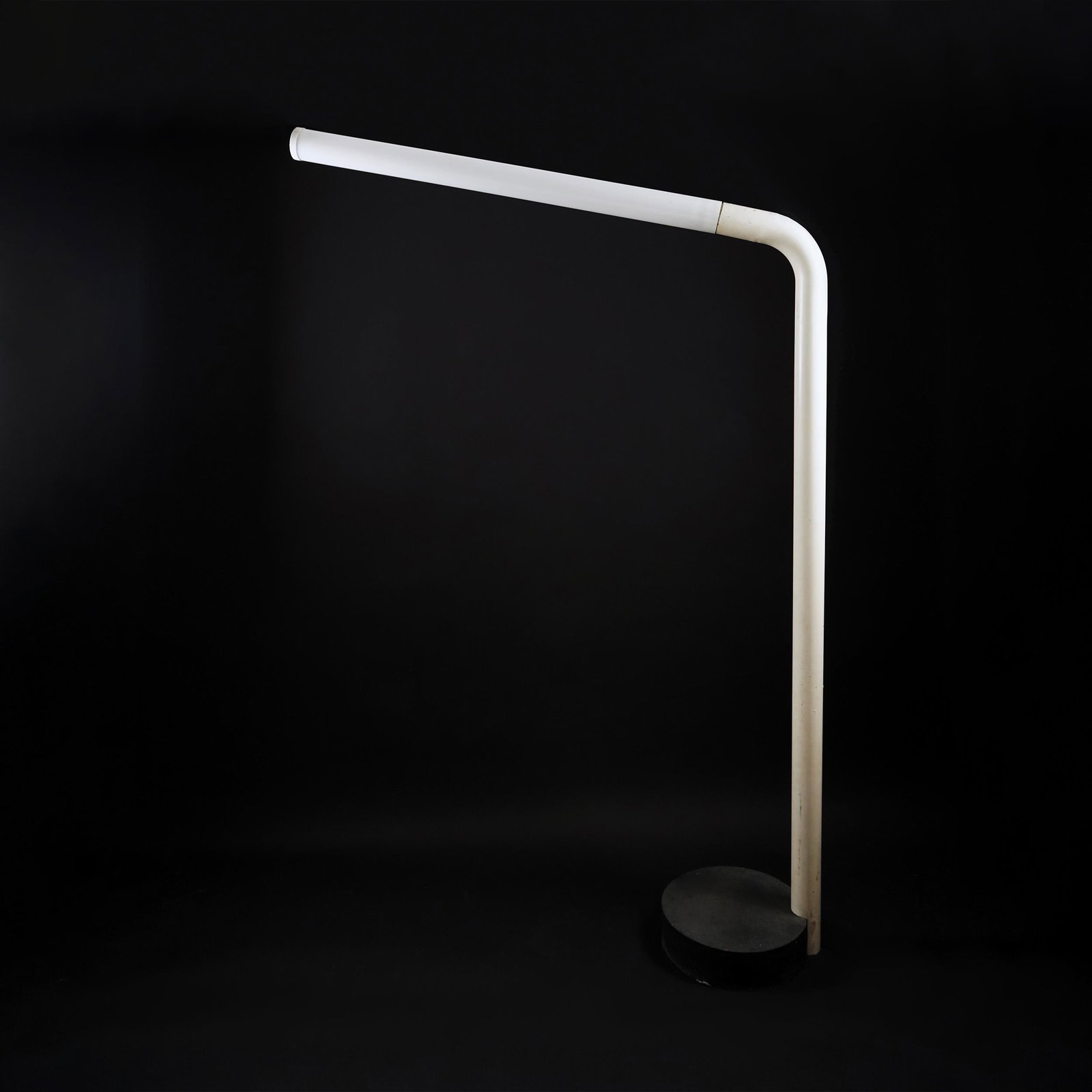 An Italian white metal and cast iron floor lamp, '70s: 201by125cm.