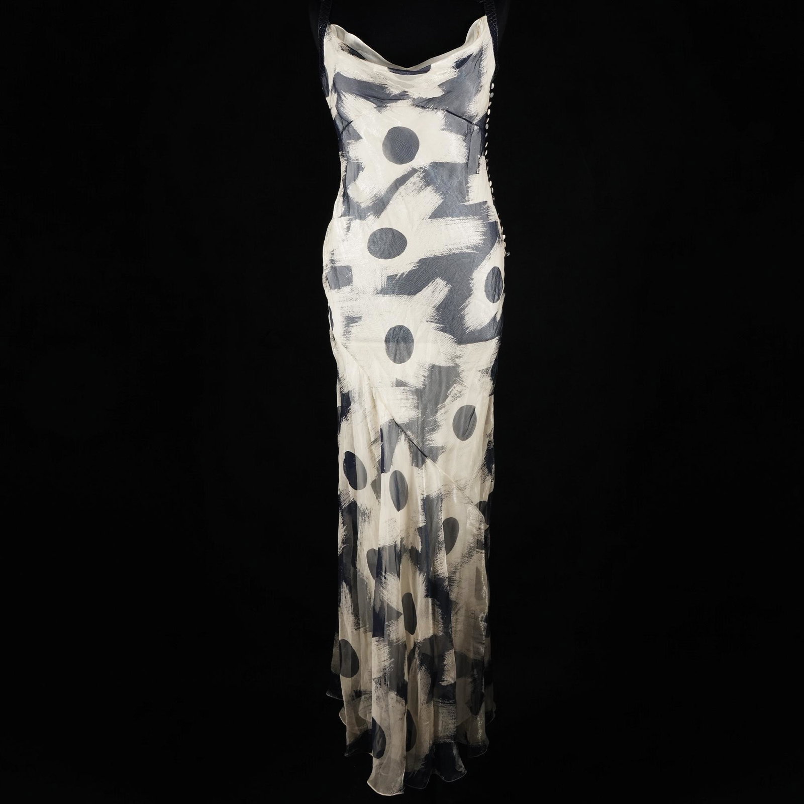 Christian Dior: a long dress in silk voile ivory background with large stylized corollas